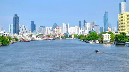 Chao Phraya River and Bangkok skyline on a sunny day